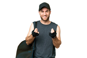 Poster - Young sport man with sport bag over isolated chroma key background making money gesture