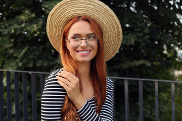 Canvas Print - Portrait of beautiful woman in glasses outdoors