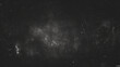 black and white  grungy, blurry smoky sky with a silver star overlay..Dust Dirt Particles Salt Snow Powder Spray. Authentic Black Rough Grunge Distressed Overlay Texture Surface. particles in space