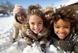 happy multiracial children laugh together in the snow in winter