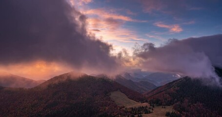 Wall Mural - clouds time lapse in autumn forest beautiful evening sunset landscape, outdoor adventure background