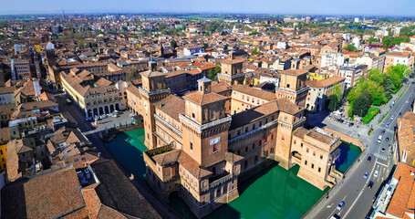 Ferrara - beautiful medieval town in Emilia Romagna Italy. aerial drone view of castle Estense in historic center.