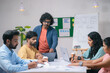 © WESTOCK - group or Team of co-workers busy working at office during discussion or business planning - concept of communication, startup coordination and leadership.