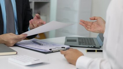 Wall Mural - Job applicant submits resume documents, manager is interviewing new employee in office.