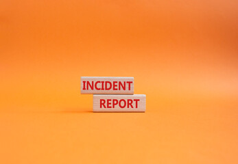 Incident Report symbol. Concept word Incident Report on wooden blocks. Beautiful orange background. Business and Incident Report concept. Copy space