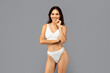 © Prostock-studio - Smiling european slim young woman in white underwear enjoy fit, weight loss, beauty care