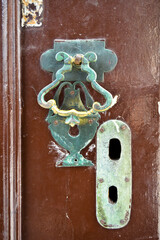 Decorative vintage old-fashioned metal door knocker and keyhole, antique door handles Turkey Istanbul