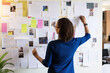 © ADDICTIVE STOCK - Anonymous Focused Woman Organizing Sticky Notes. Generative AI