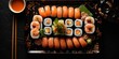 A platter of sushi rolls with a mix of nigiri, sashimi, and soy sauce on the side - Elegant and authentic - Moody, low-key lighting for a sophisticated look - Top-down shot, 