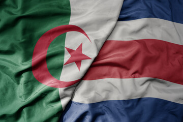 Wall Mural - big waving national colorful flag of costa rica and national flag of algeria .