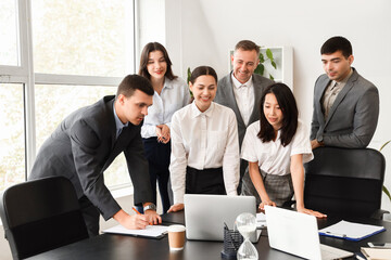 Sticker - Business colleagues working at table in office