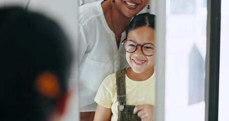 Canvas Print - Mirror, child and choice for glasses, smile and eye care for healthcare, reflection and decision for eyewear. Happy girl, medicare and excited for frame, optometry and consulting or wellness vision