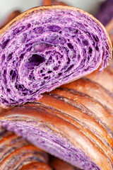 Wall Mural - Fresh baked homemade Ube Croissant using traditional flavouring.