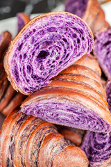 Wall Mural - Fresh baked homemade Ube Croissant using traditional flavouring.