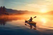 A Lone Woman Kayaks On A Tranquil Lake As The Sunrise Spills Golden Light Through The Mist, Creating A Peaceful Moment Of Connection With Nature