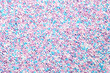 © Peter Hermes Furian - Colorful sprinkles made of tiny sugar balls. Mix of purple, blue, rose and white nonpareils. Decorative and edible Hundreds and Thousands made of sugar and starch, used as decoration and as topping.