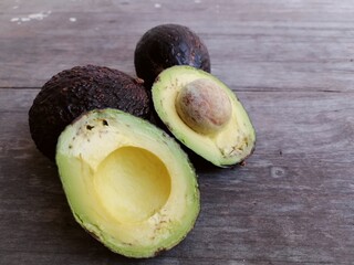 Poster - Fresh avocado fruit on table wood background