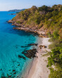 © Fokke Baarssen - Koh Samet Island Thailand, aerial drone view from above at a couple of men and woman on the beach of Samed Island in Thailand with a turqouse colored ocean and a white tropical beach