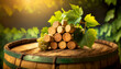 Closeup of a group of wine corks in the shape of a bunch of grapes with green vine leaves, on an old wooden wine barrel with copy space. In the background a vineyard at sunset or sunrise.