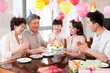 © Blue Jean Images - Happy family celebrating birthday