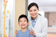 © Blue Jean Images - Cheerful doctor and boy in children's hospital