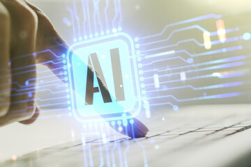 Wall Mural - double exposure of creative artificial intelligence icon with hands typing on laptop on background. 