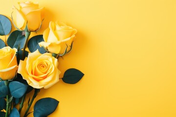 Canvas Print -  a bouquet of yellow roses with green leaves on a yellow background with a place for a text or a picture.