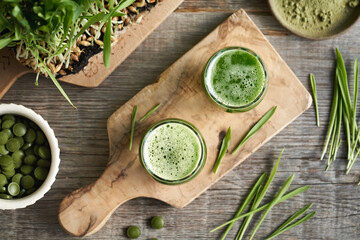 Wall Mural - Fresh green barley grass juice with homegrown blades, with barley grass powder and tablets