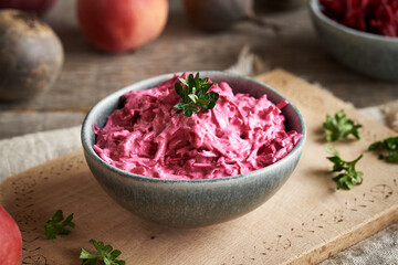 Wall Mural - Fresh beetroot salad with apples and sour cream in a bowl