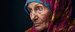 © Mickael - Close up portrait of old Woman arab muslim elderly in hijab . female brown eyes and face covered. Oriental girl in a burqa. Straight look expressive eyes, close-up portrait. Generative ai