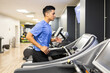 © ADDICTIVE STOCK - Young man running in treadmill workout