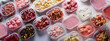 Top view of plastic rectangular open containers of ready-to-eat or convenience foods. Useful daily rations to order food, delivery of ready meals on pink background.
