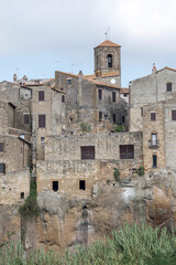 Wall Mural - san Rocco bell tower and medieval houses on cliffs, Pitigliano, Italy