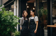 © ArtCookStudio - two women standing in front of a cafe
