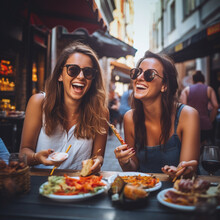 Friends eating at a street food market.