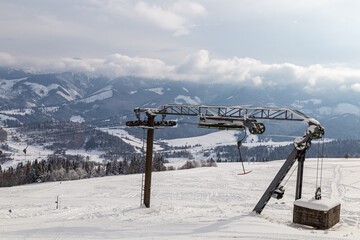 rope tow, ski lift at the top of snowy mountain. zuberec ski park. slovakia. western tatras. skiing.