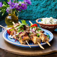 Wall Mural - Delicious Greek lamb souvlaki skewers on a plate with salad.