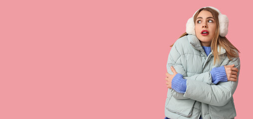 Poster - Freezing young woman in winter clothes on pink background with space for text