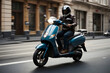 © igor.nazlo - Motorcyclist in black jacket and helmet riding a scooter on the street