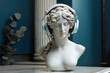 Sculpture of of the Greek goddess wearing headphones.