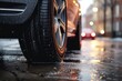 A detailed view of a car tire on a wet street. Ideal for automotive-related projects and articles about road safety