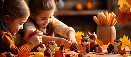 Autumn crafts Children s fall crafts and creativity Hedgehog made from modeling clay sunflower seeds and nuts on dry yellow leaves Ideas for children s art. Copy space image