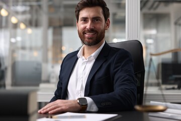 Wall Mural - Portrait of smiling lawyer at table in office