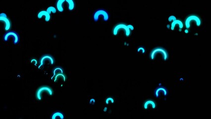 Wall Mural - neon rings move and vibrate in space. design. small neon rings vibrate in dark space. luminous rings