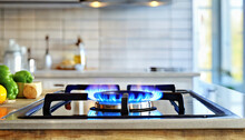 gas stove with flame in modern kitchen