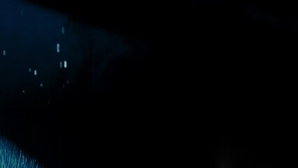 abstract dark background with blue cold flashing light beam spot and laser illuminate falling rain a