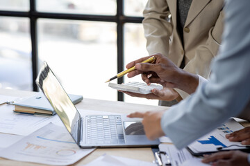 Wall Mural - Investment Consultant, Asian business adviser meeting to analyze and discuss the situation on the financial report in the meeting desk office .Financial advisor and accounting concept