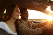 © New Africa - Happy couple enjoying trip together by car, selective focus