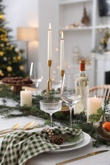 Wall Mural - Christmas table setting with festive decor and dishware in room