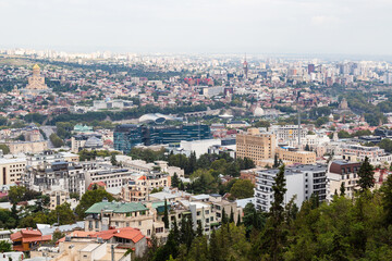 Wall Mural - travel to Georgia - above view of Tbilisi city from Mtatsminda Pantheon viewpoint on autumn day